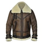 Men's brown leather shearling aviator jacket with cream fur collar, cuffs, hem, front zipper, and strap details